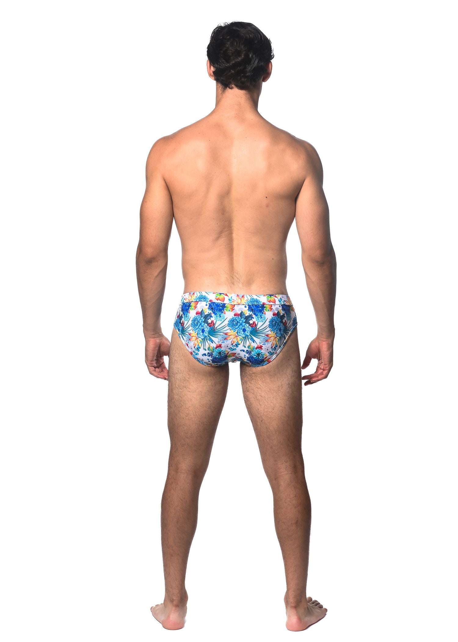 Tropics printed swim brief featuring blue and yellow floral patterned swim trunks for beachwear