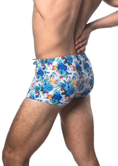 Blue and multicolored tropical floral printed swim trunk featuring vibrant patterns perfect for beachwear