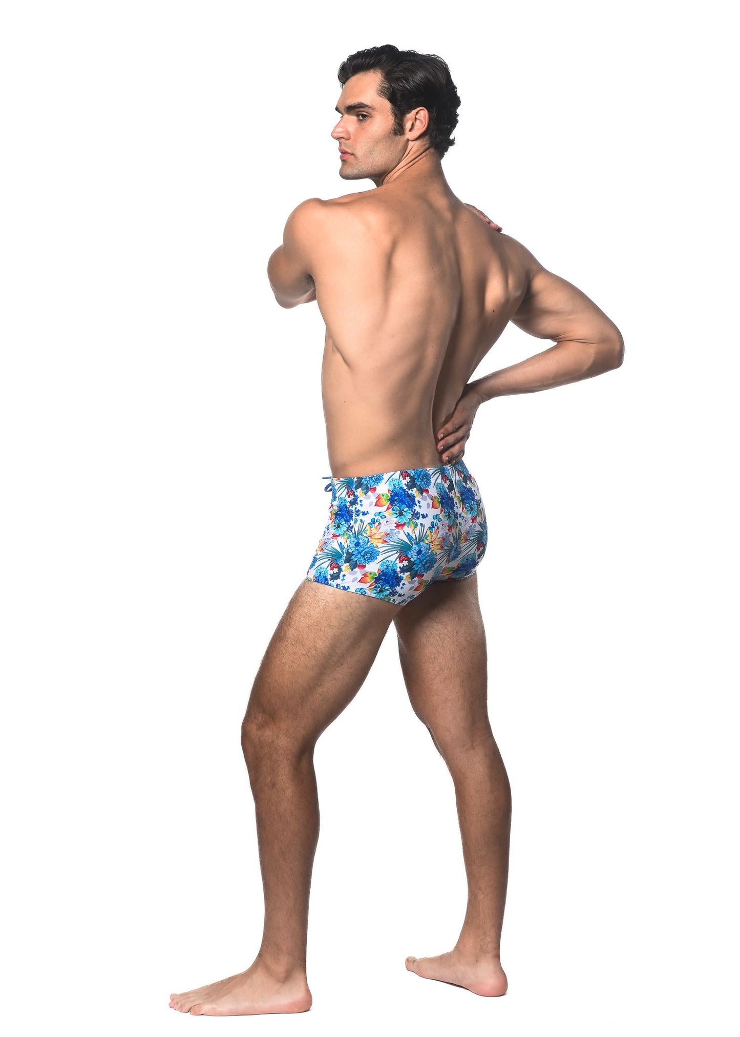 Blue floral-patterned tropics printed swim trunks made of lightweight fabric for comfortable beachwear