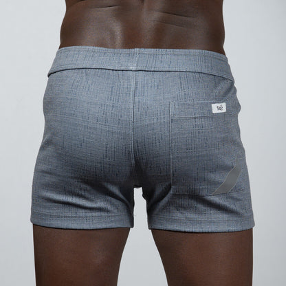 Back side of gray tulio linen texture shorts featuring a subtle woven pattern and a small white brand tag on the pocket