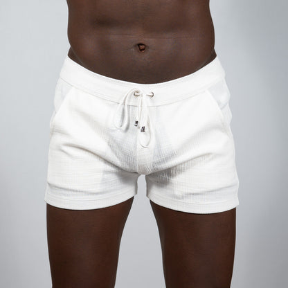 White textured linen shorts with drawstring waistband and subtle horizontal ribbing from tulio linen texture shorts assortment
