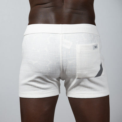White tulio linen texture shorts featuring a subtle gray accent on the side pocket and a breathable fabric design