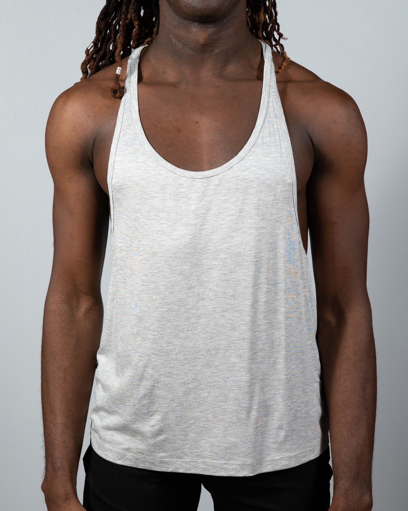A light gray heathered cotton tulio racerback tank top with a classic racerback design shown from the back side