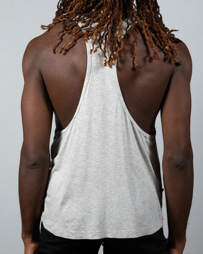 A heather gray tulio racerback tank with relaxed fit and subtle side seam detailing shown from the back side