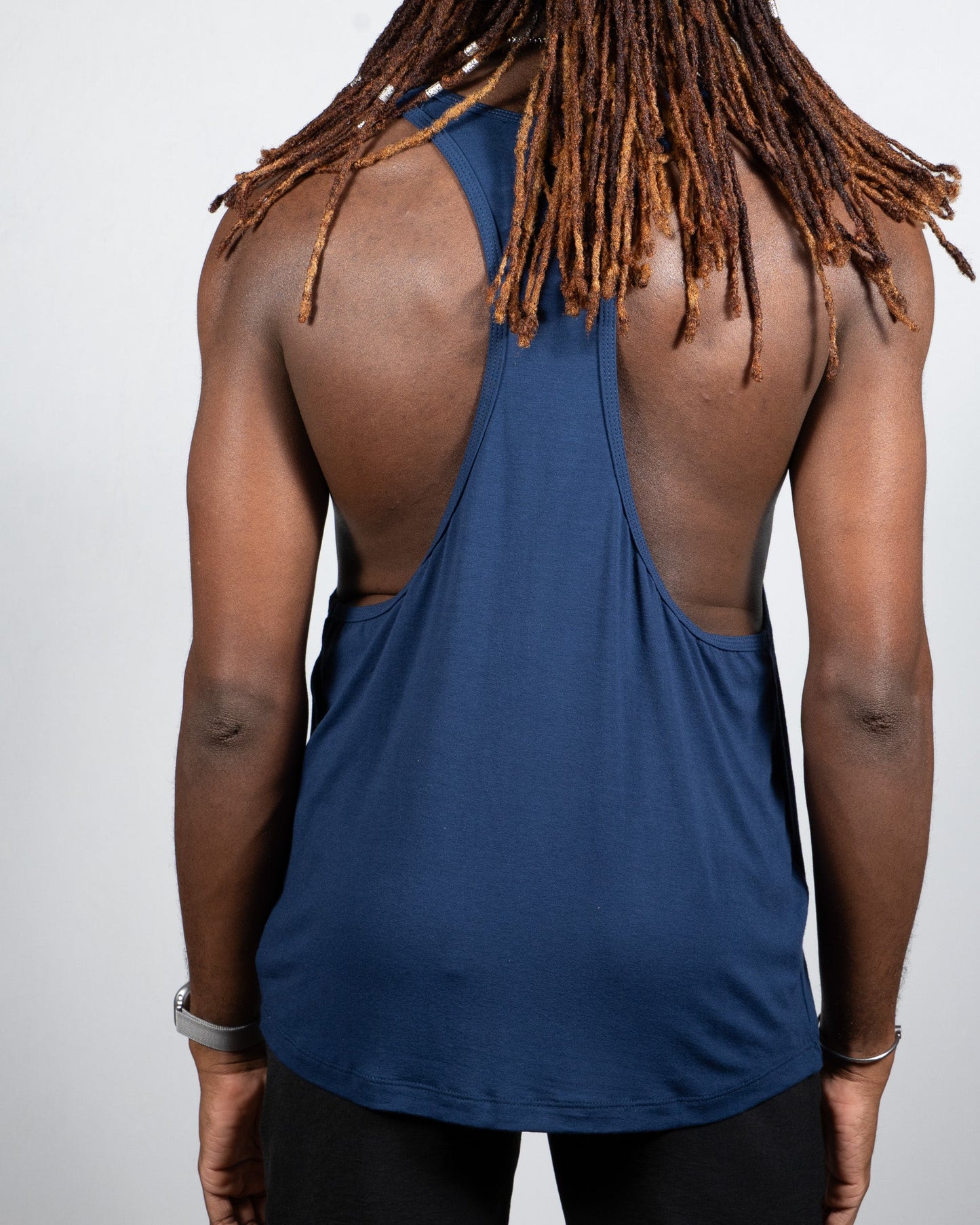 Navy blue tulio racerback tank top with cutout back design made of breathable fabric for activewear use visible from back side