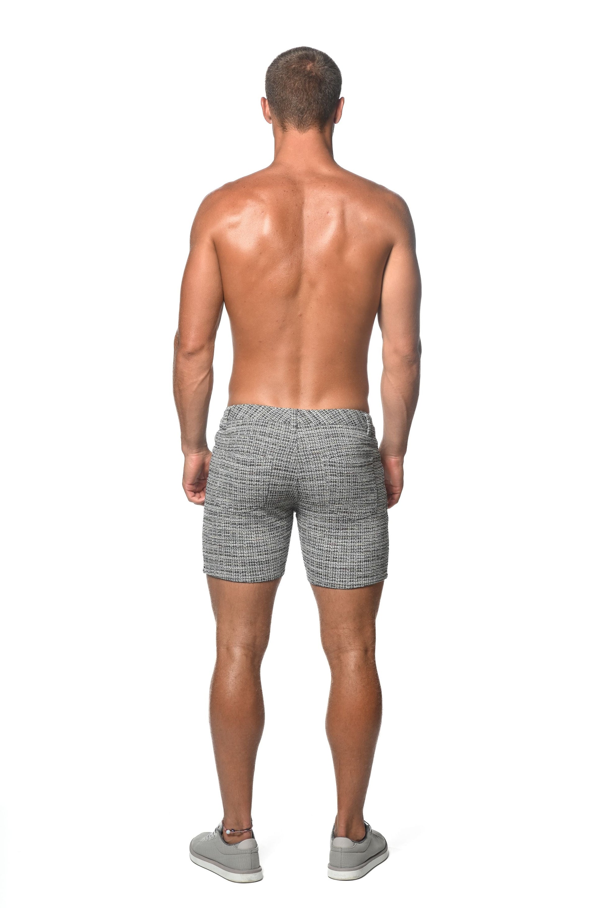 Gray tailored tweed-look jacquard stretch knit shorts with a herringbone pattern and slim fit design