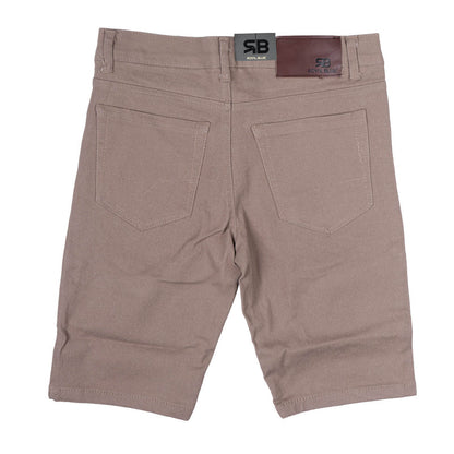 Beige twill stretch skinny shorts with subtle texture and two back pockets featuring branded waistband labels