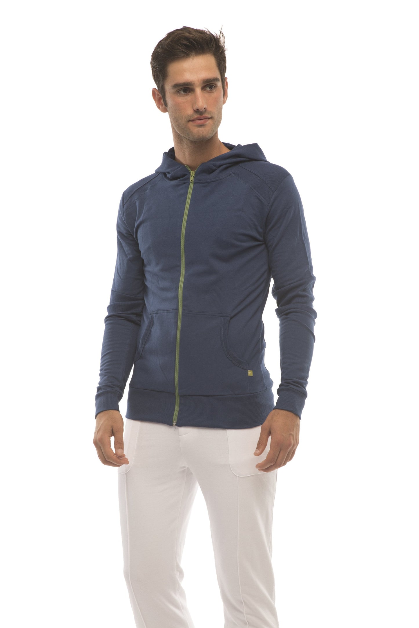 Navy blue tactical urban zip-up hoodie with lime green zipper and subtle logo on lower left sleeve in white pants