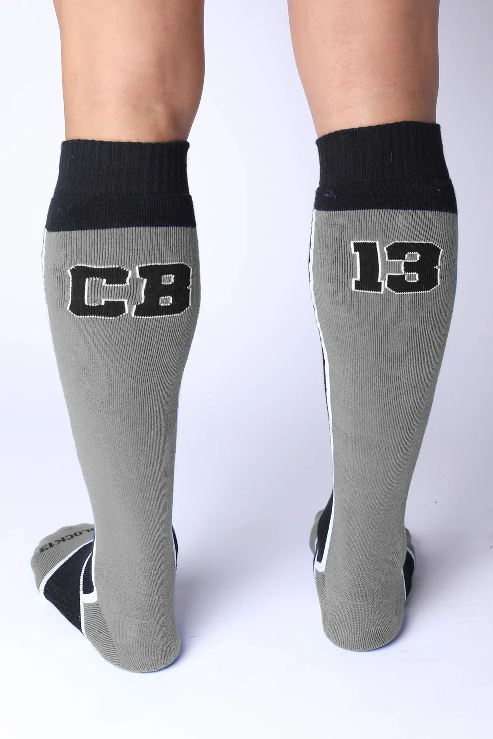 Gray knee-high socks with black ribbed cuffs. Left sock has CB, right has 13 in block letters.
