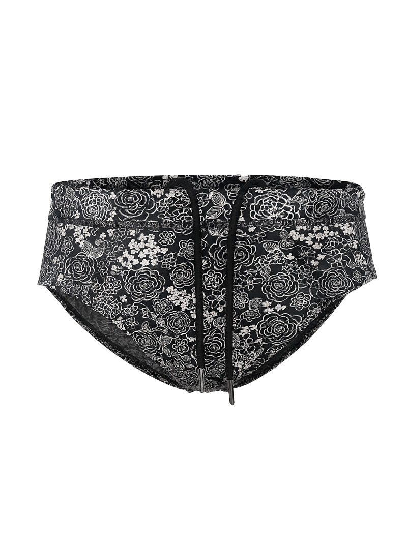 Black tartarus swim brief with white floral and bird pattern and drawstring waistband for beachwear