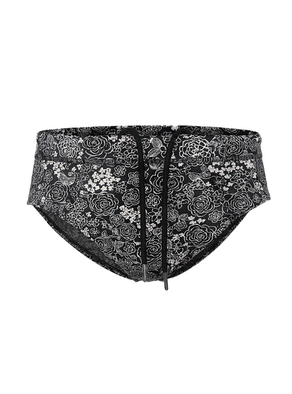 Black tartarus swim brief with white floral and bird pattern and drawstring waistband for beachwear