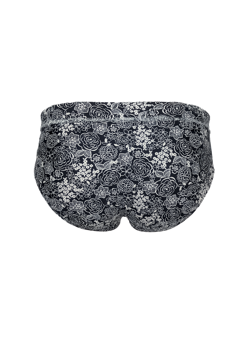 Black tartarus swim brief with delicate white and gray rose floral pattern designed for swimwear use