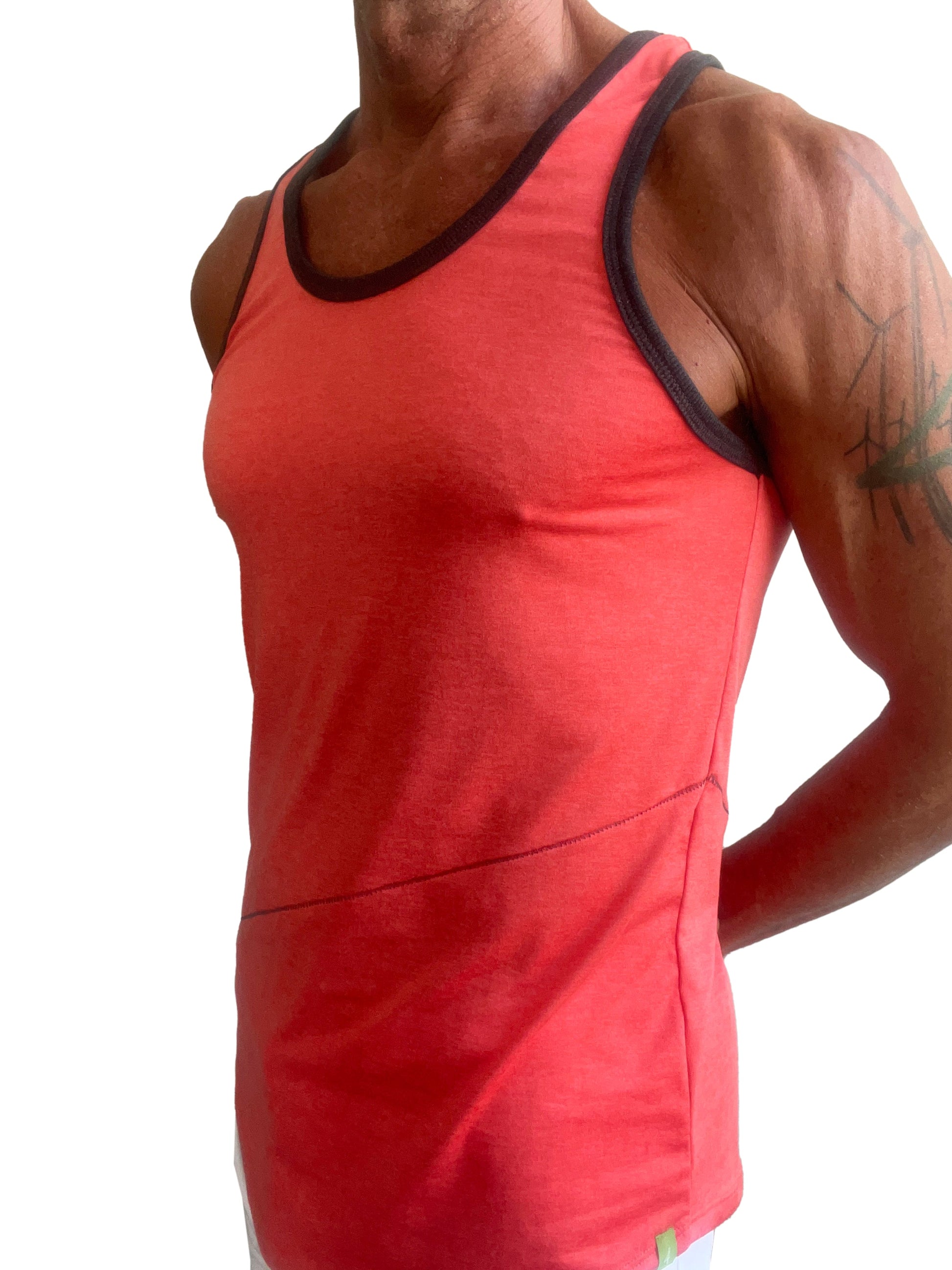 A vibrant coral-red tank top with black trim and subtle side seam detail from the perfect tank coral collection