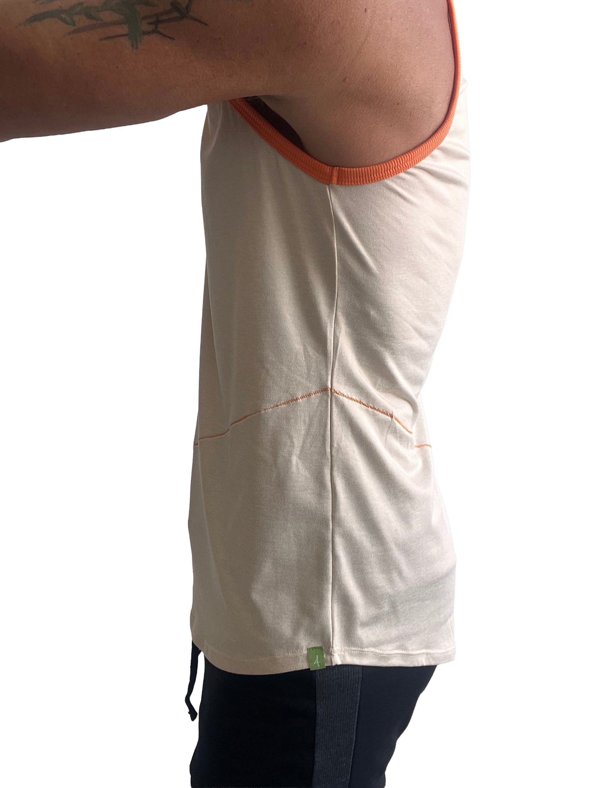 Cream-colored tank top with orange ribbed trim and subtle stitching details in sand beige perfect tank design