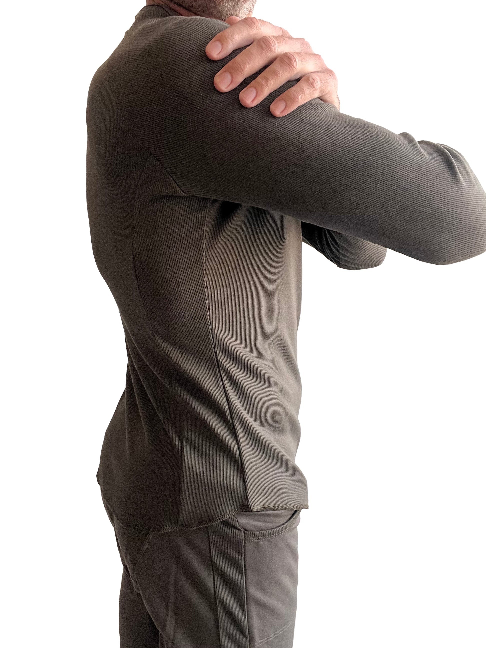 A fitted dark olive green thermal v-neck long sleeve shirt with ribbed texture and athletic cut
