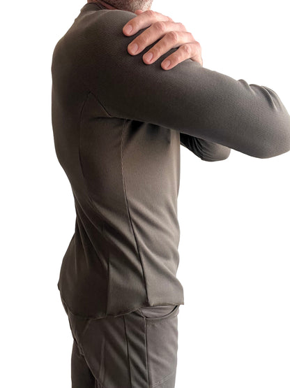 A fitted dark olive green thermal v-neck long sleeve shirt with ribbed texture and athletic cut