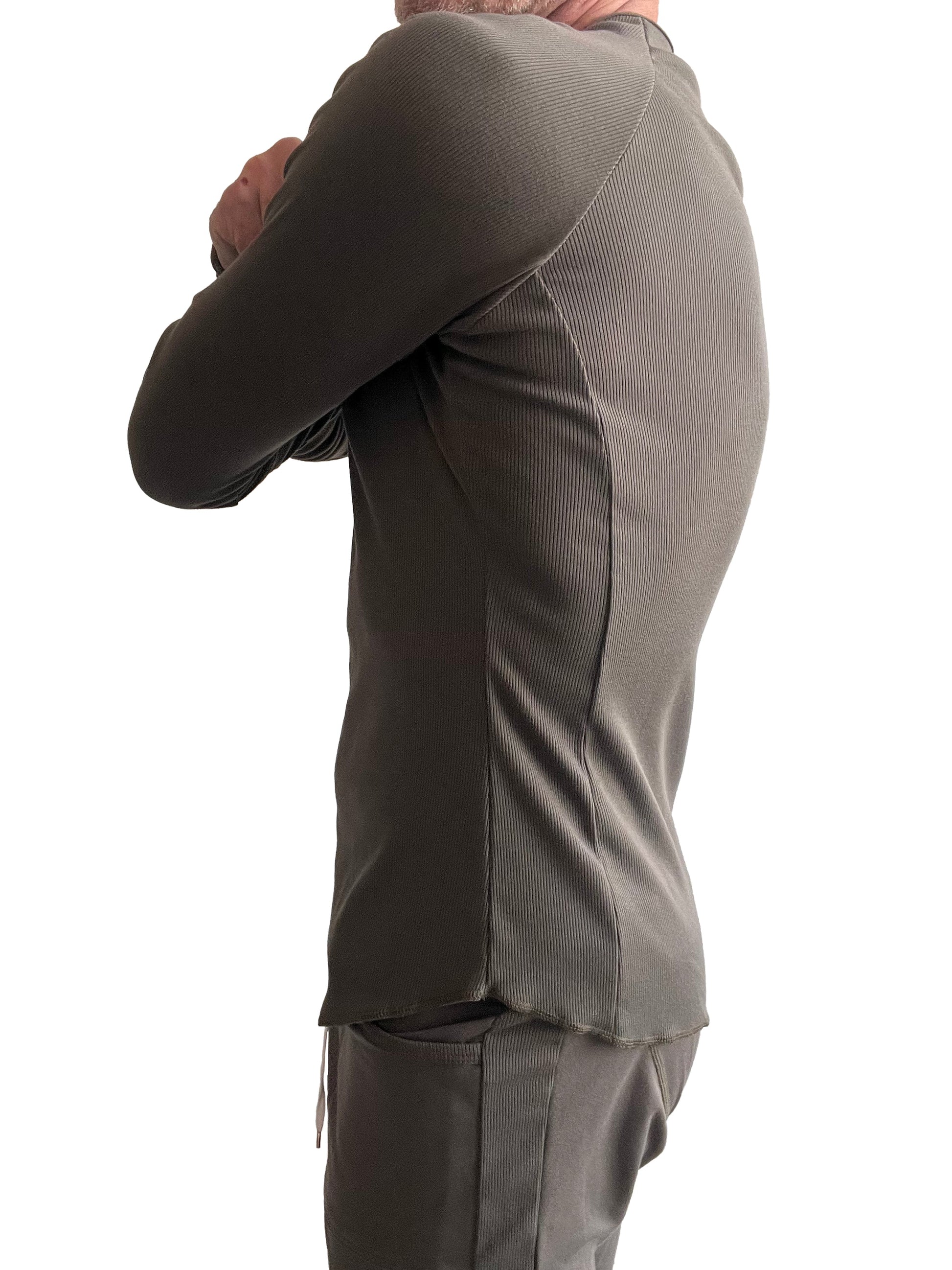 A sleek olive green thermal v-neck long sleeve ribbed top with tailored fit and subtle side seam detailing