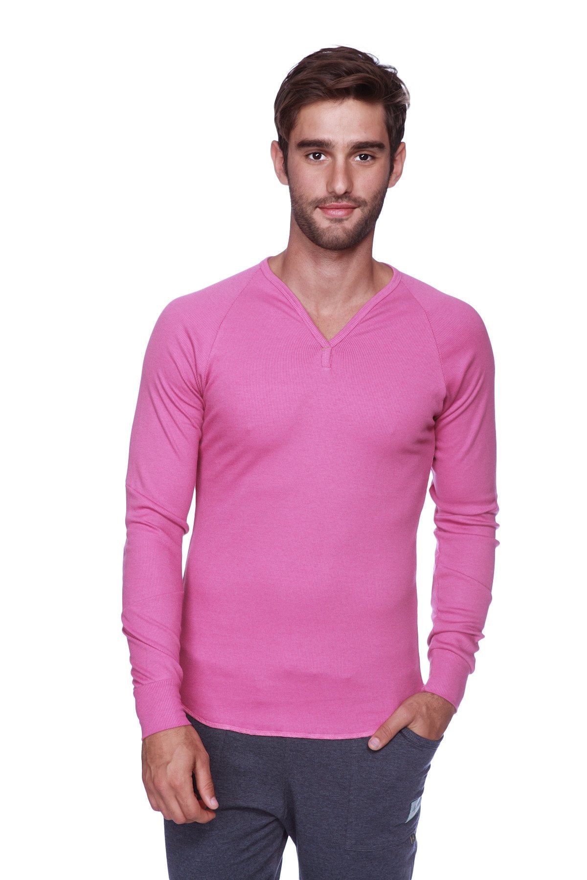 A vibrant pink thermal v-neck long sleeve sweater with subtle ribbed texture and raglan sleeves in berry color