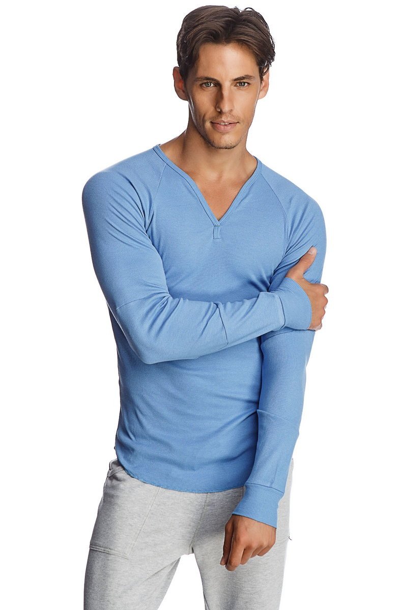 Light blue thermal v neck long sleeve shirt with ribbed texture and raglan sleeves