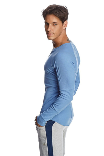 A light blue thermal long sleeve ribbed knit shirt with a rounded neckline and v neck detail