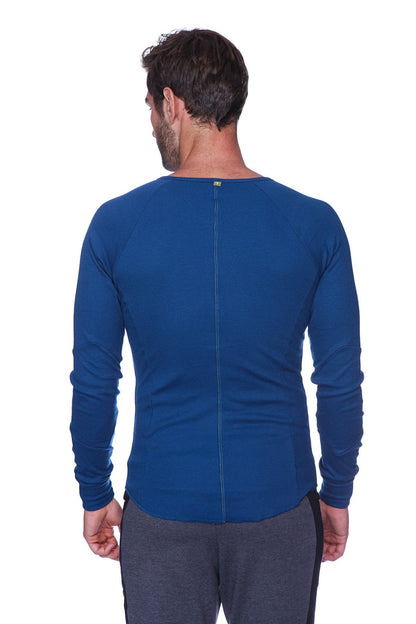 Thermal v-neck long sleeve royal blue athletic shirt with ribbed neckline and back zipper shown from the back side
