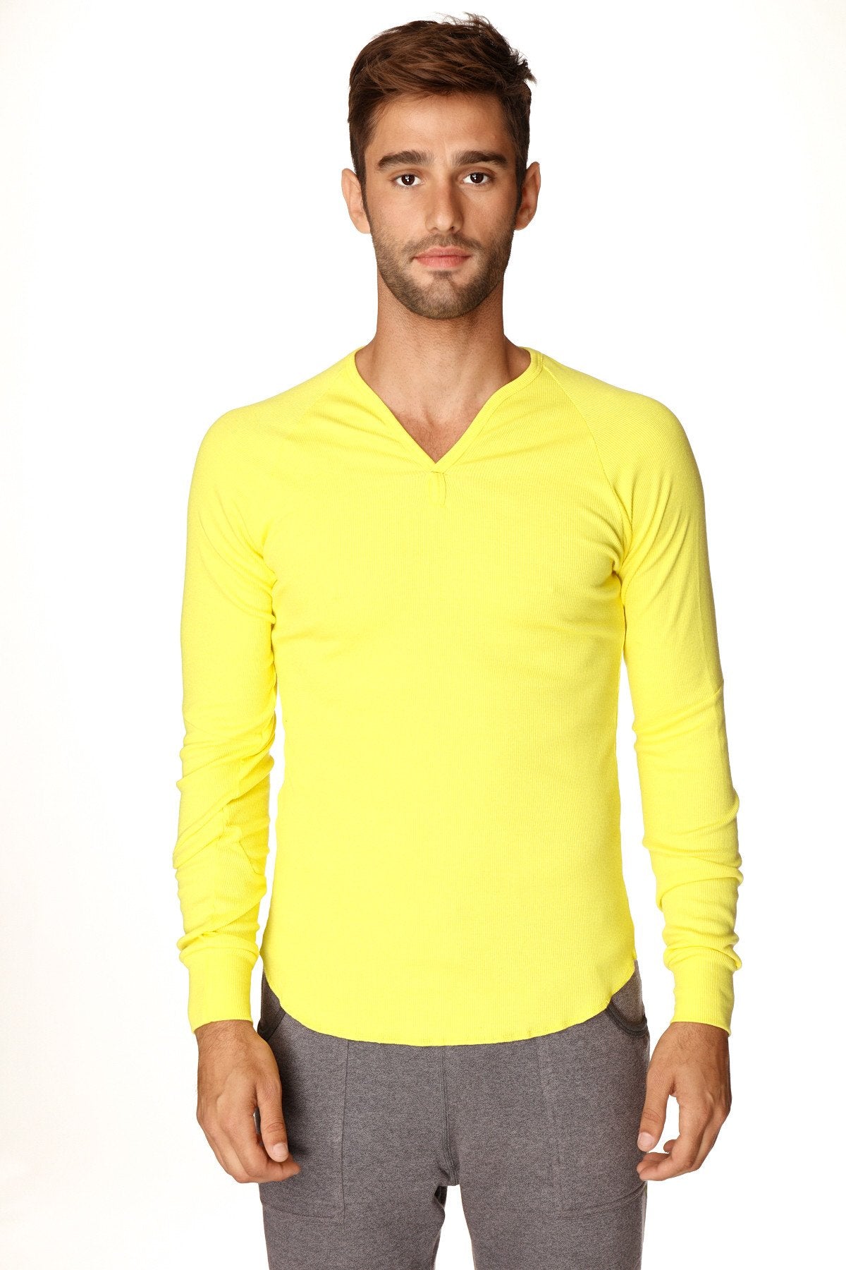 Bright yellow thermal v-neck long sleeve shirt made of warm fabric for cozy casual wear in tropic yellow