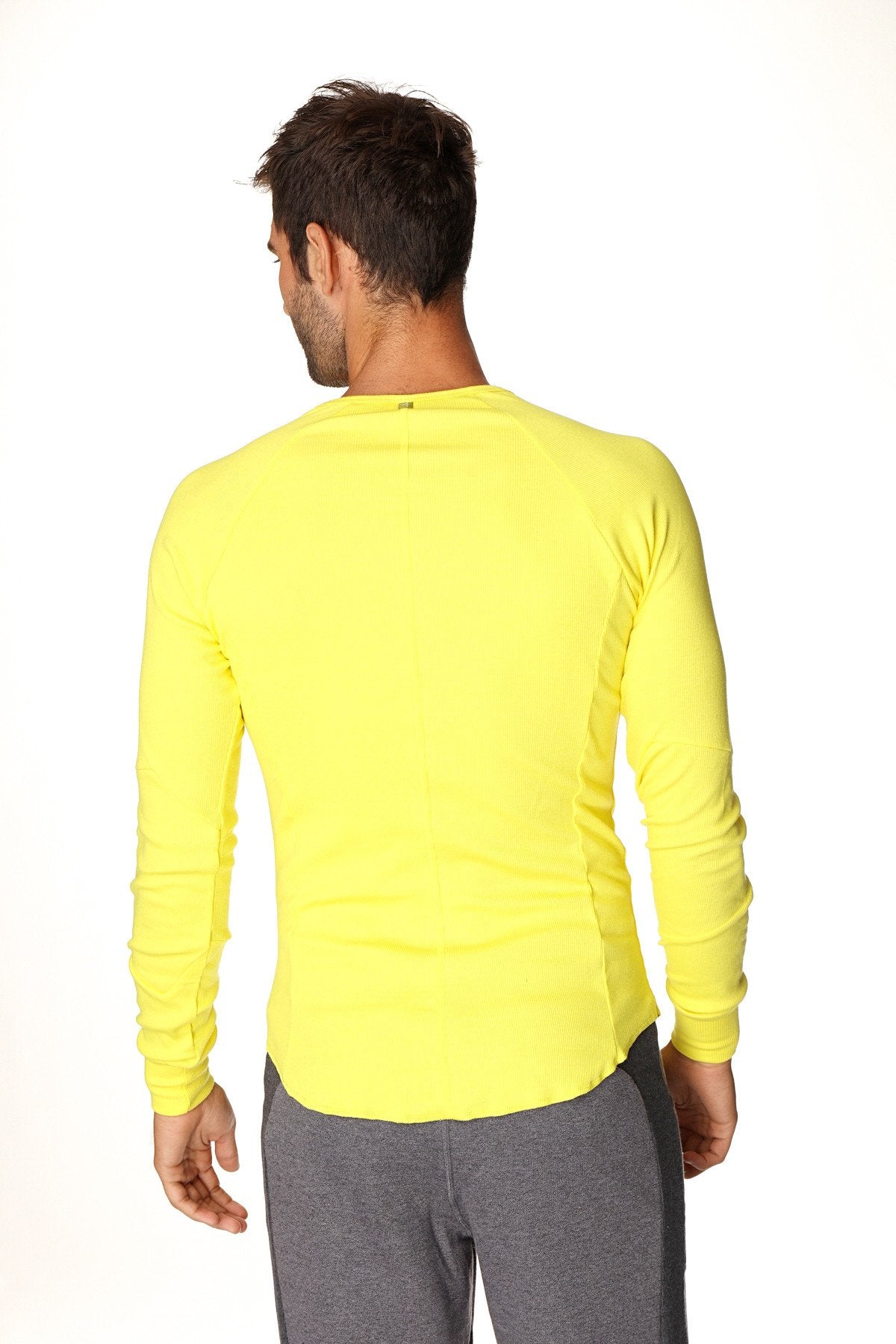 Thermal v-neck long sleeve athletic shirt in tropic yellow with fitted cut and ribbed cuffs for cold weather wear