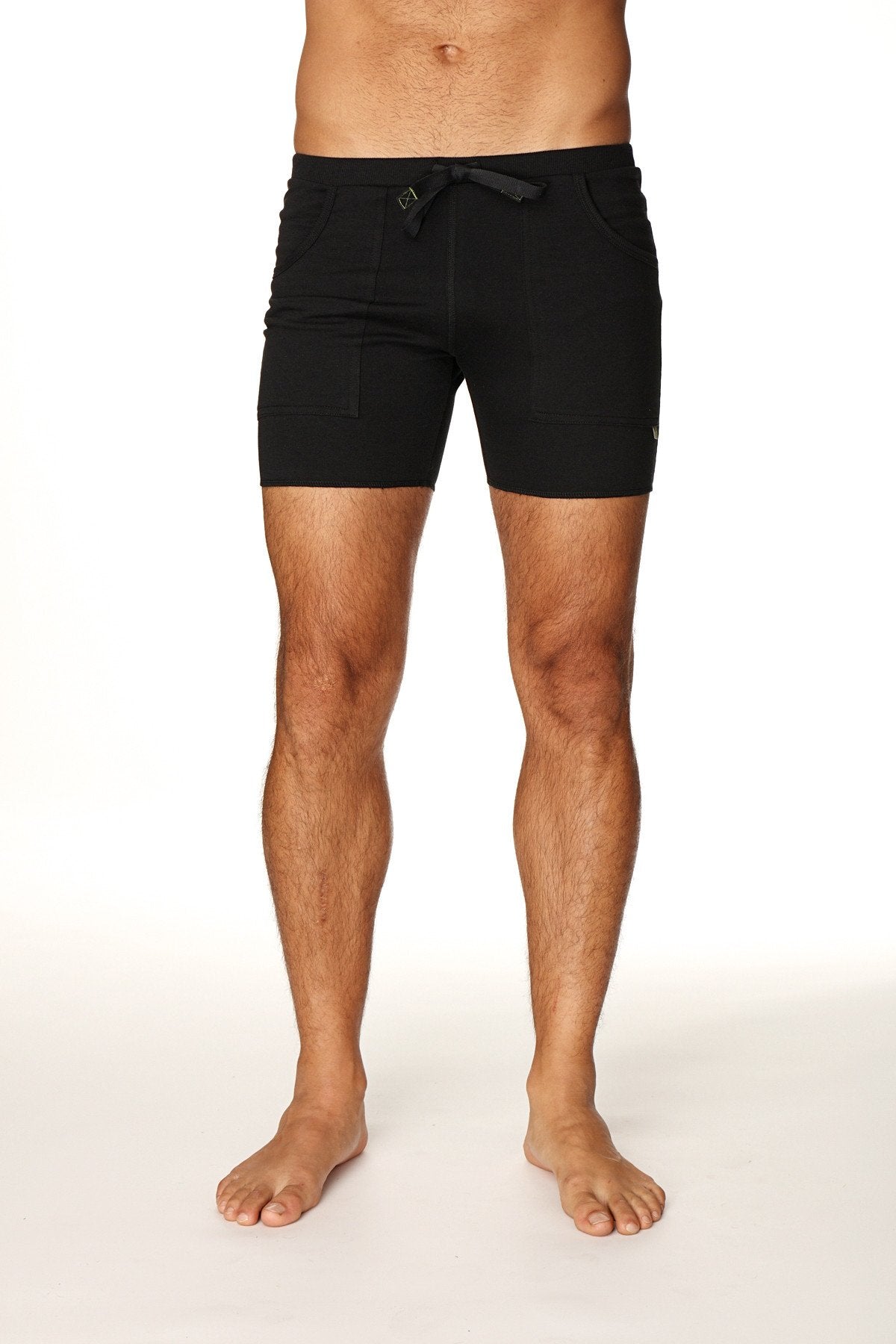 Black transition yoga shorts with sleek minimalist design and subtle waistband branding for active wear