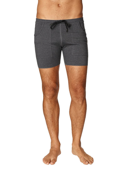 Dark gray heathered transition yoga shorts with drawstring waistband and two side pockets in charcoal with black details