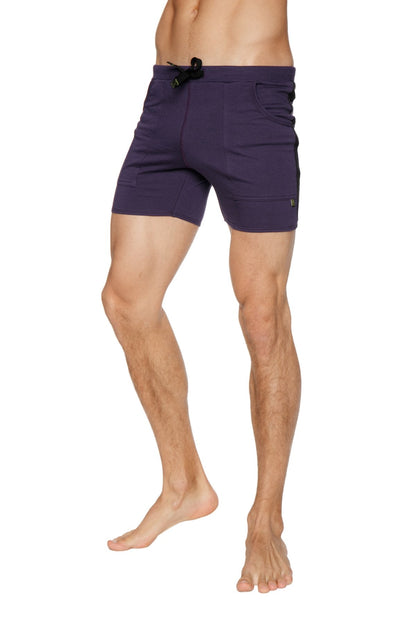 Transition yoga shorts in eggplant purple with black drawstring waistband and side pockets for athletic use