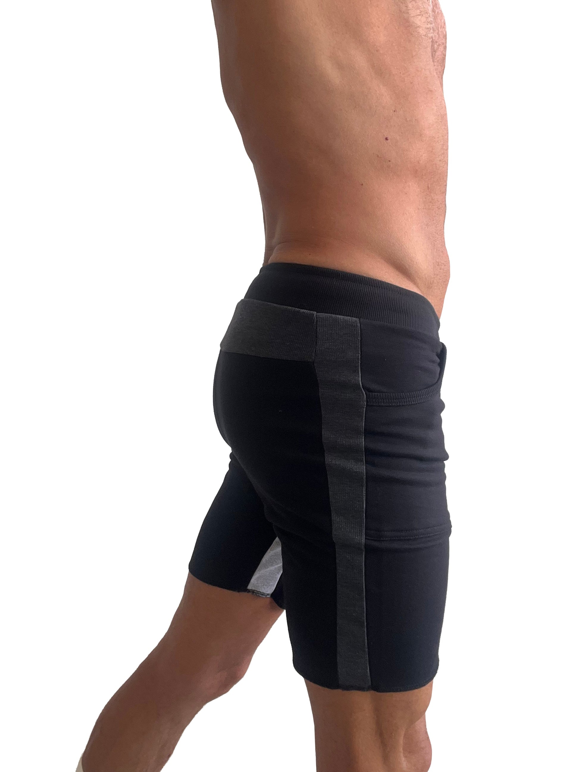 Black tri-color ultra-flex yoga track shorts with ribbed waistband and dark gray vertical side stripes