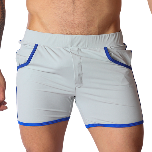 Front view of Gigo Typer gray athletic fabric shorts with blue contrast piping and elastic waistband.