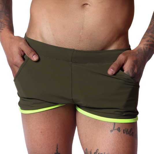 Front view of Gigo Typerhot green athletic shorts in smooth fabric with neon yellow trim and side pockets.