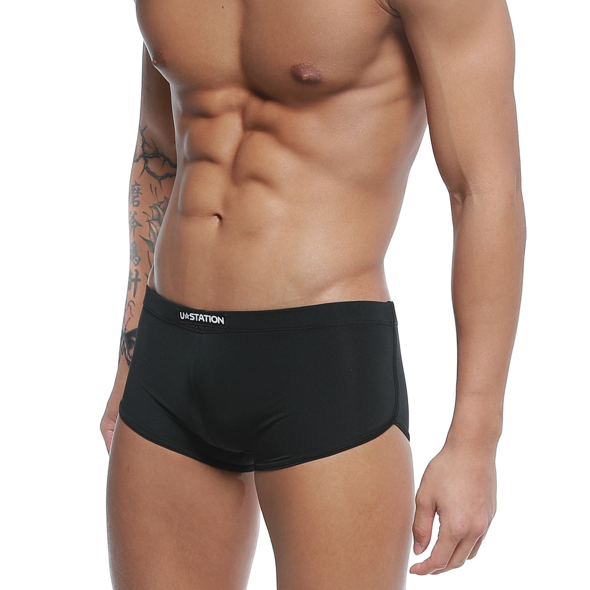 Black ua u-station brazilian trunk briefs with sleek form-fitting design and subtle white waistband branding