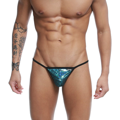 Shiny teal sequined u-station string thong with black trim and shiny material in blue peacock color front view