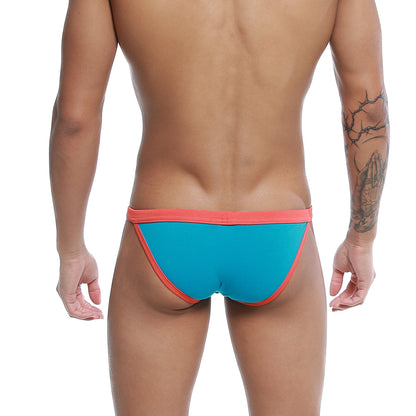 U-Station Frisa bikini turquoise men’s briefs in bright turquoise and coral with a snug form-fitting design