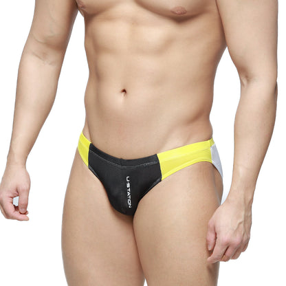 Black and yellow U-Station Fab Brief U2302-001 swim trunks with white side panel and vertical brand name lettering