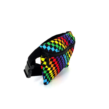 Ultra slim fanny pack made of rainbow checkered fabric with a black zipper and adjustable strap for hands-free use