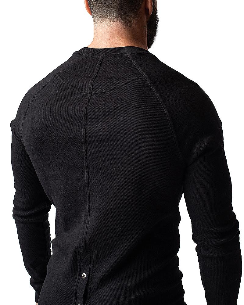 Black ribbed long-sleeve thermal union suit with crew neck and back button detail showing the back side