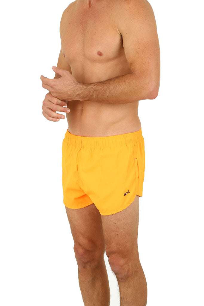 Uzzi running short bright yellow athletic shorts with elastic waistband and small logo on the side