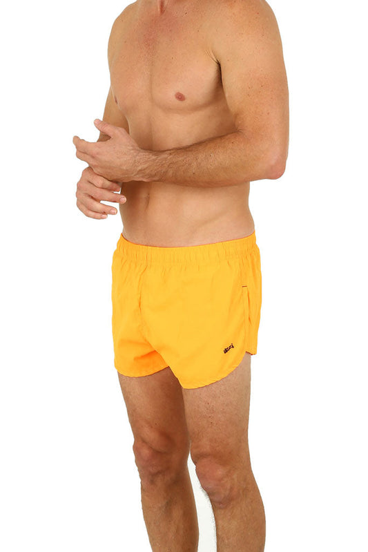 Uzzi running short bright yellow athletic shorts with elastic waistband and small logo on the side