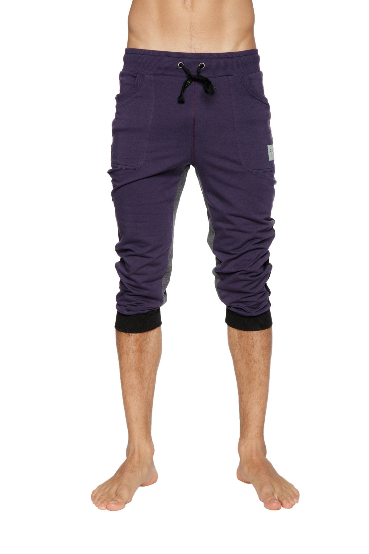 Purple ultra-flex tri-color cuffed yoga pant with black drawstring waistband and ribbed cuffs in capri length