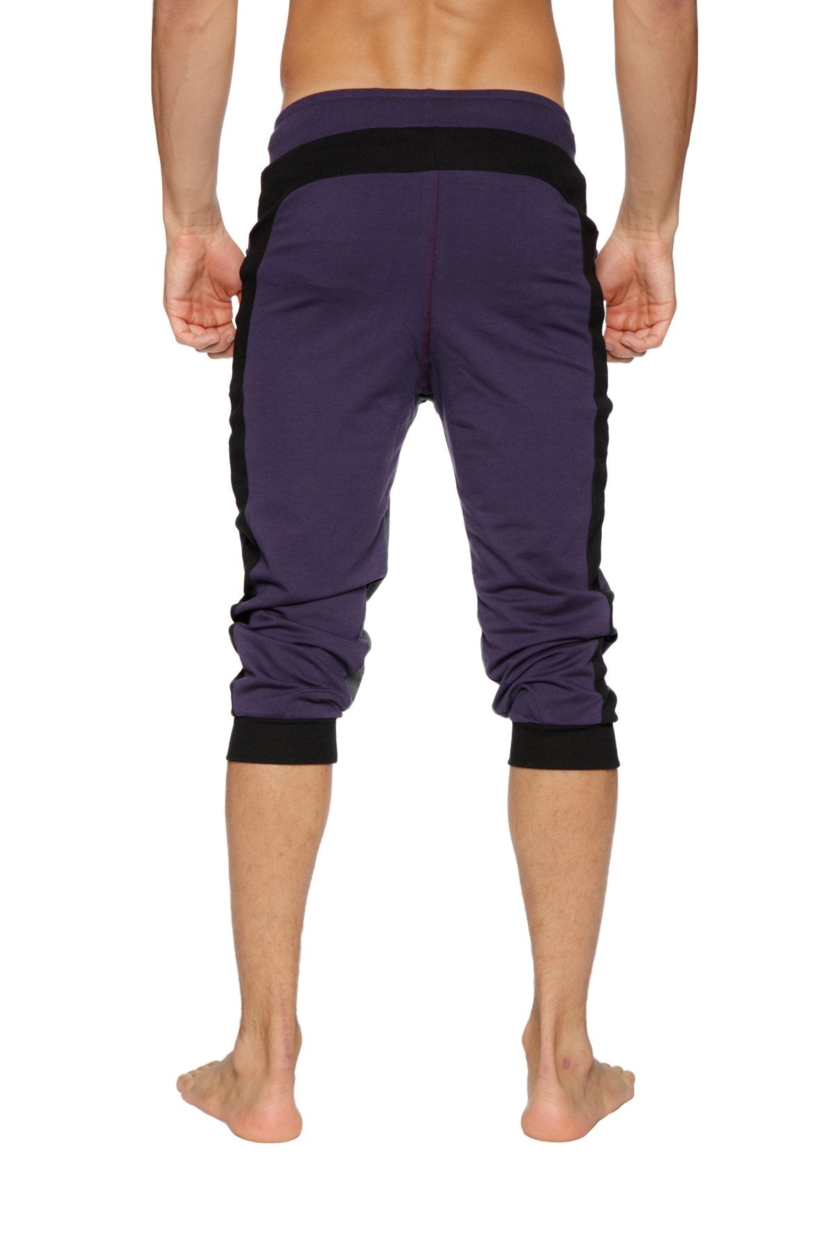 Purple Ultra-Flex tri-color cuffed yoga capris with black side panels and elastic cuffs for athletic use