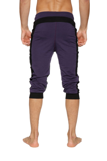 Purple Ultra-Flex tri-color cuffed yoga capris with black side panels and elastic cuffs for athletic use