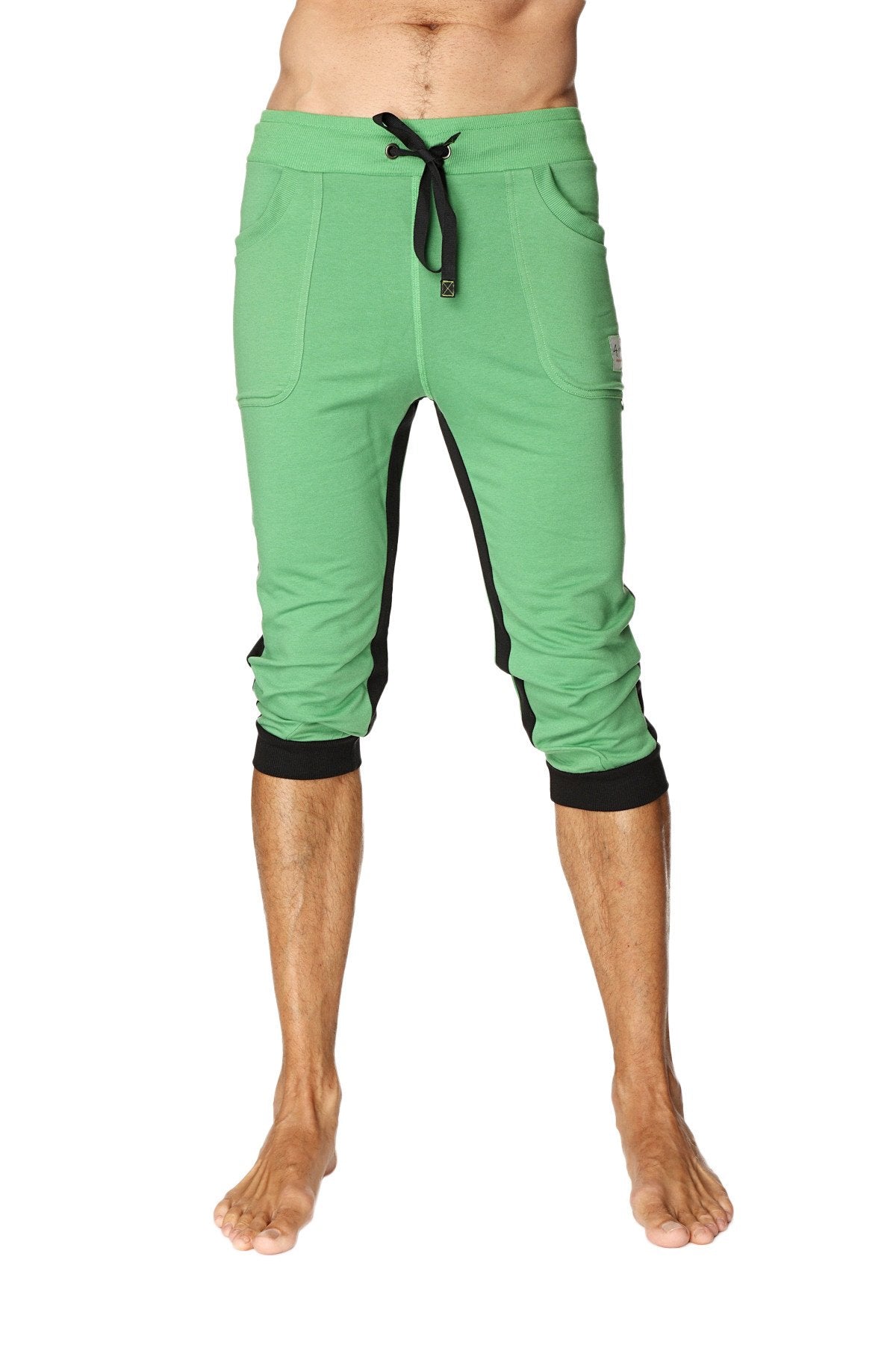 Green ultra-flex tri-color cuffed yoga pant with black side panels and elastic cuffs in capri length
