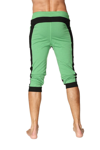 Green ultra-flex tri-color cuffed yoga pants with black side panels and elastic cuffs for flexible workouts