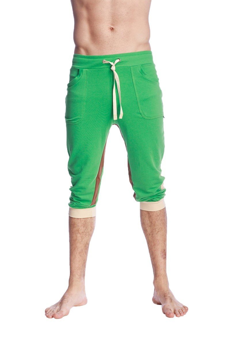 Green ultra-flex tri-color cuffed yoga pant with beige drawstring and matching cuffs in capri-length jogger style