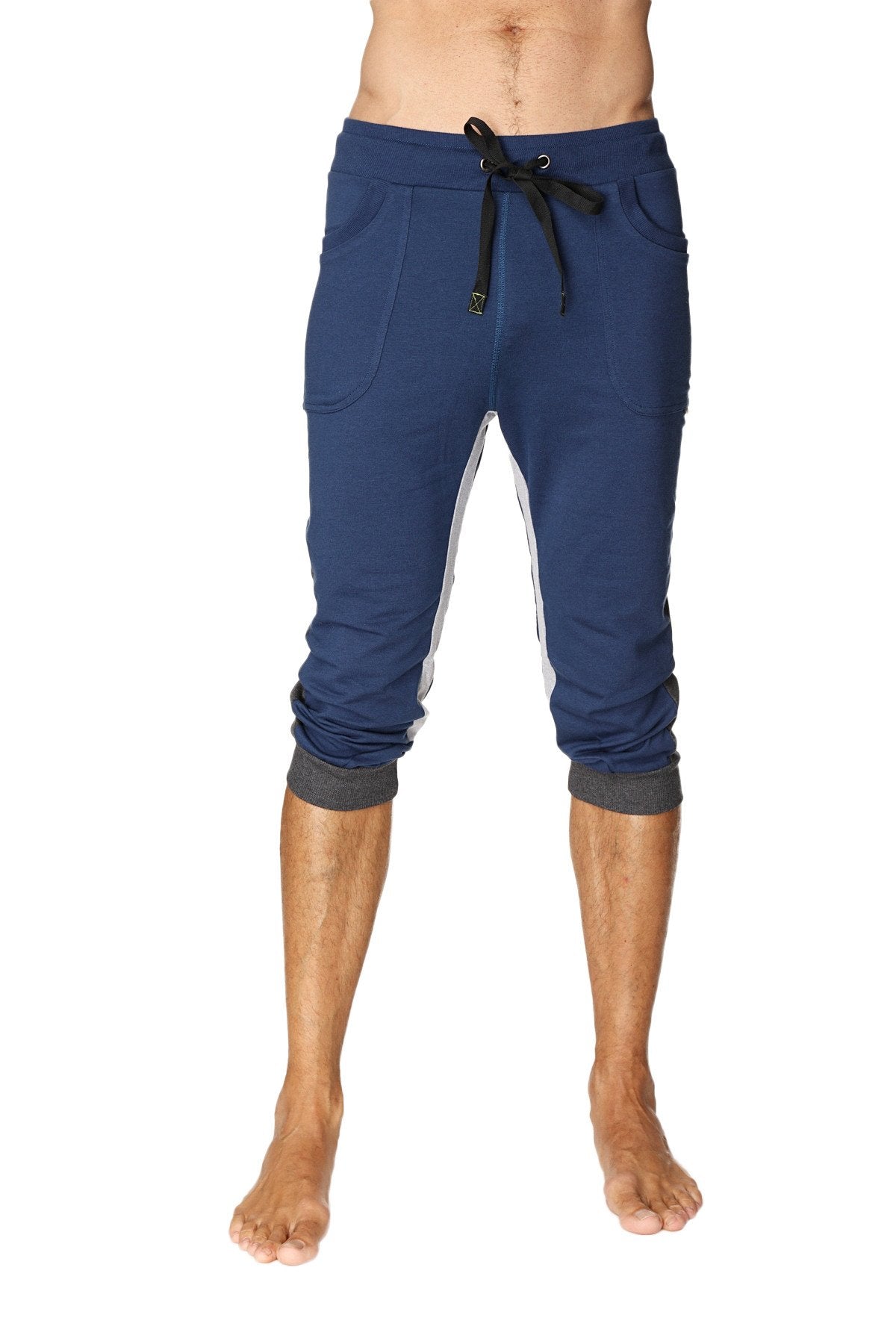 Navy blue ultra-flex tri-color cuffed yoga pant with white side panels and black drawstring waistband in capri length