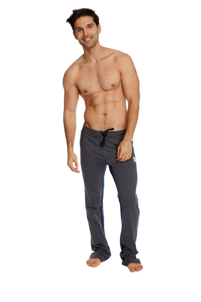 Dark gray ultra flex yoga track and sweat pant with drawstring waistband and subtle blue side stripes in charcoal