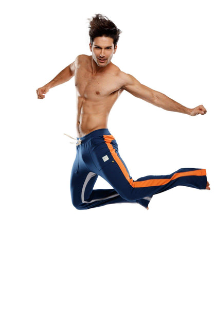 Ultra flex yoga track and sweat pant in navy blue with orange and white side stripes designed for athletic use